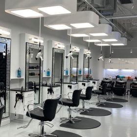 Modern salon interior at Hudson Salon in Charlotte, NC, featuring LP12 light platforms and Freestylist weightless dryers.