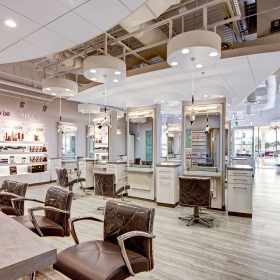Interior salon photo showing Freestylist dryers and retail display wall