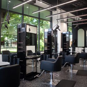 Freestylist-equipped stations near large salon windows