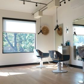 Modern salon interior with weightless blow dryers at Artim Studio in East Hanover, NJ