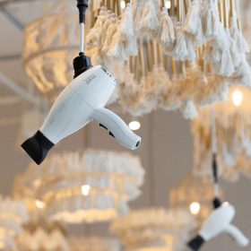 Close-up of Freestylist suspended blow dryer in modern salon