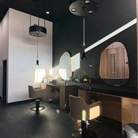 Bloom Salon styling stations with black LP03 round light platforms and weightless dryer system