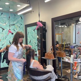 Busy salon environment with stylists working at AOC Salon Norfolk VA